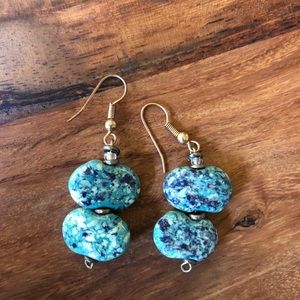 Handmade clay bead earrings in speckled green.